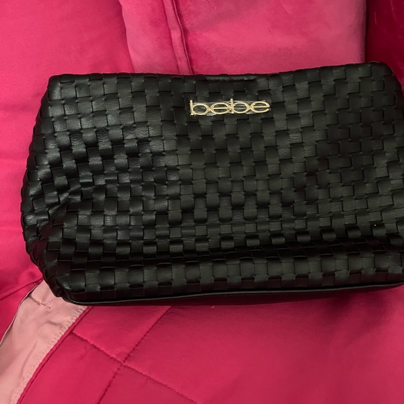 bebe Handbags - Bebe Black Woven Clutch with Gold Logo